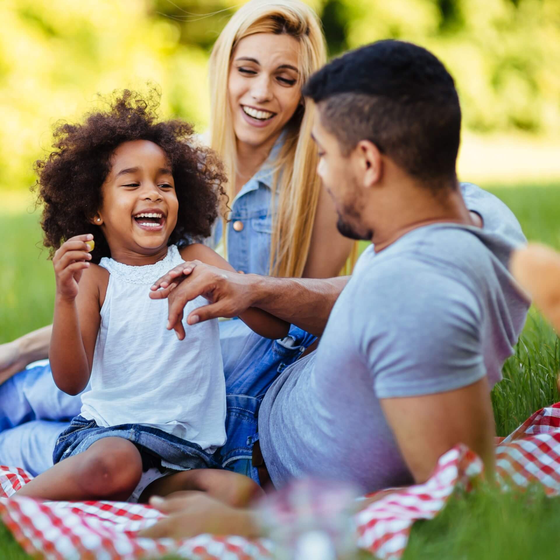 Family Dentistry under one roof Photo of a happy family resting in the park