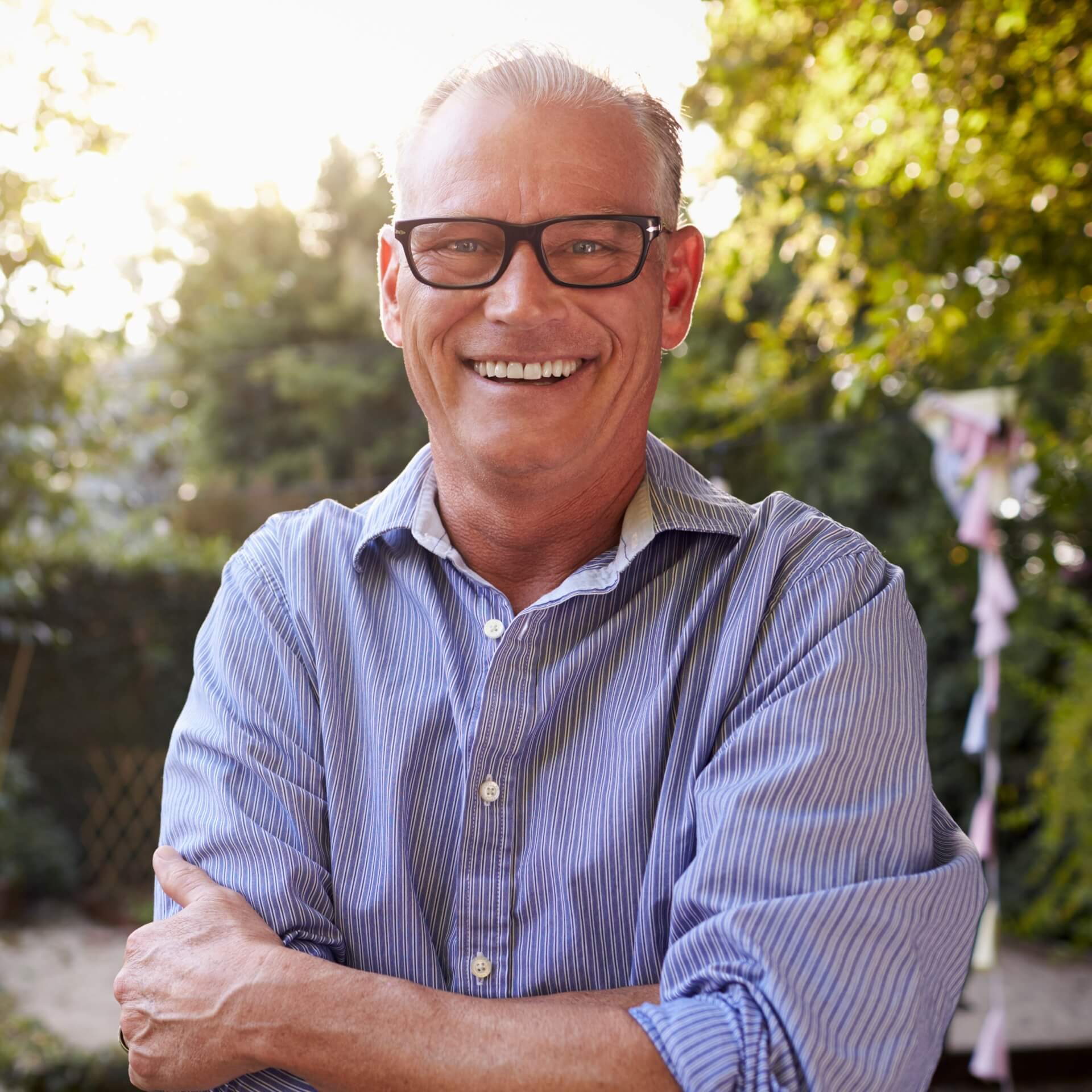 Restore your smile with dental implants A mature man with dental implants smiling